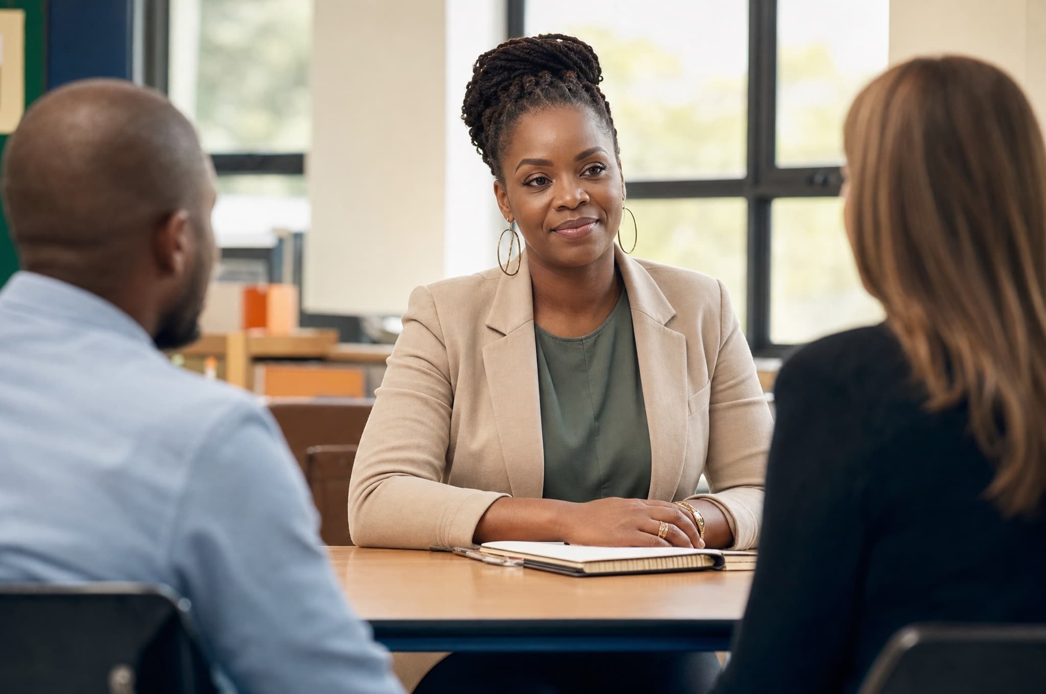 A confident parent prepared at a school IEP meeting with educators
